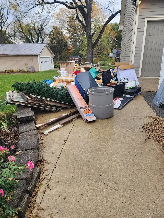 Dumpster being loaded with debris for Roofing Dumpster Rental in Thousand Oaks